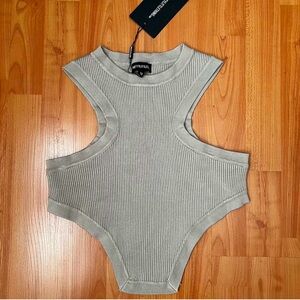 KNIT TOP WITH DIP HEM